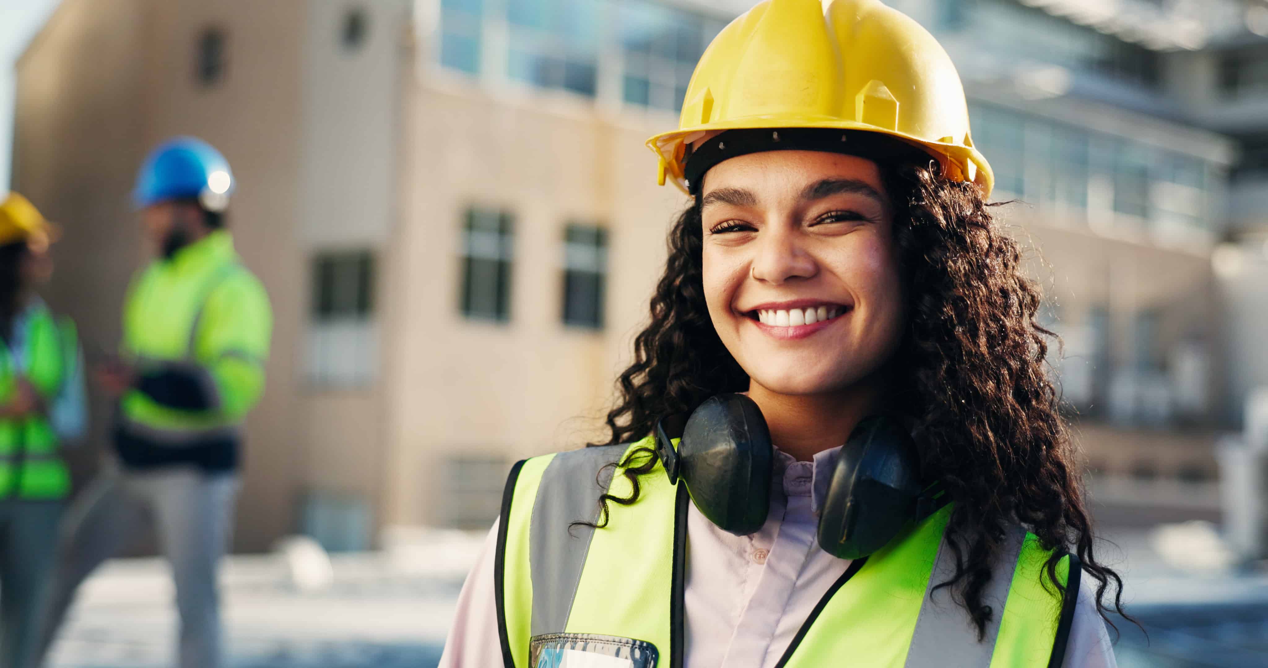 A construction project manager taking a call on an active jobsite