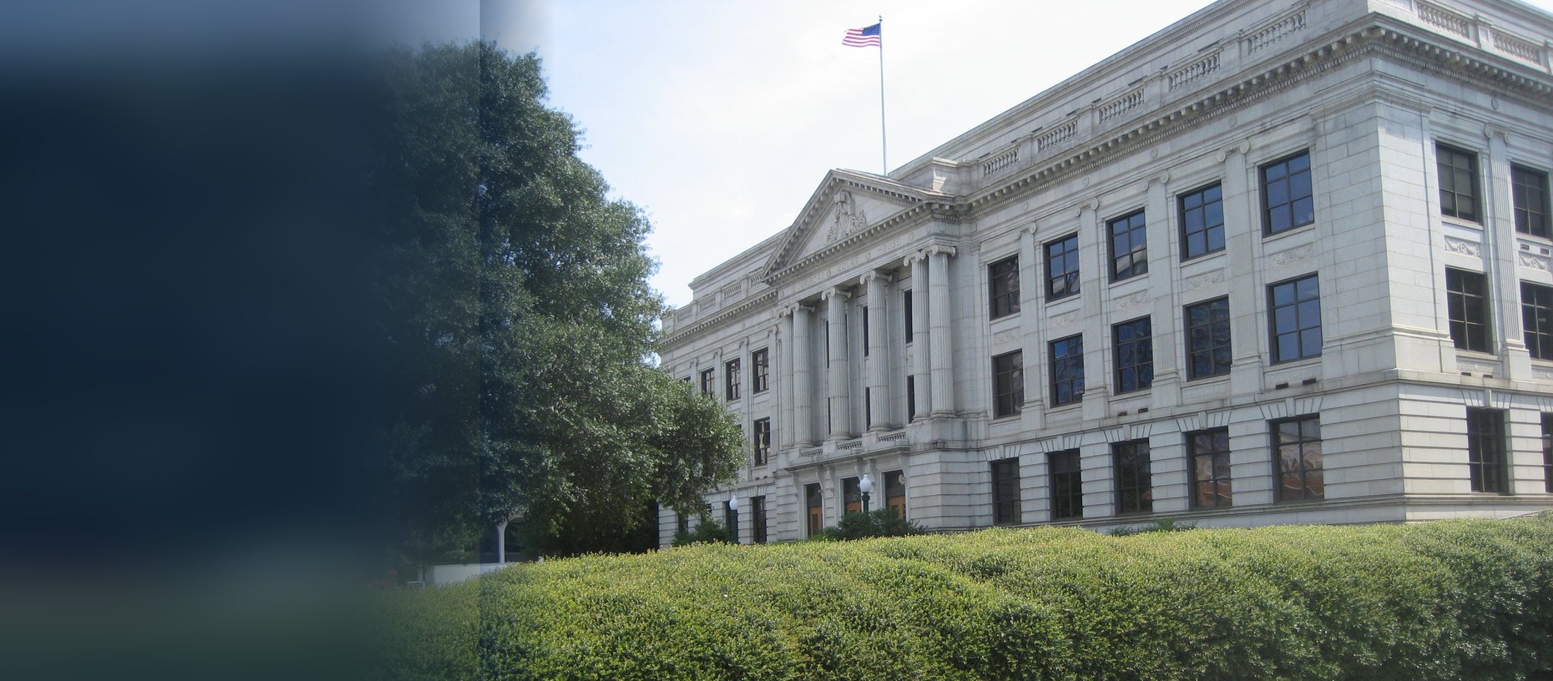 The Guilford County Courthouse in Greensboro, North Carolina, with the American flag flying above it